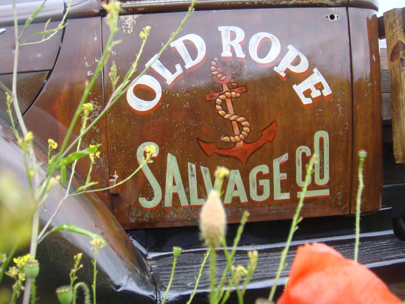 Sign-writing the Old Rope Salvage logo on to our 1941 Ford truck