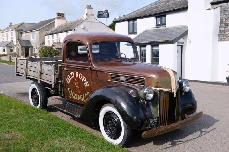 1941 Old Rope Salvage Ford Truck parked up in Cornwall village