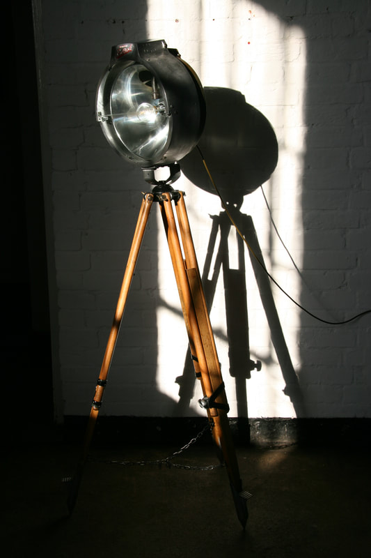 Upcycled British Bullfinch Floodlight on surveyor's tripod