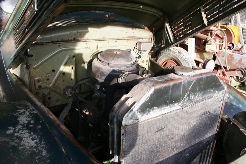 1949 Ford Flathead V8 engine in the abandoned shell of a 1941 Ford pick-up truck