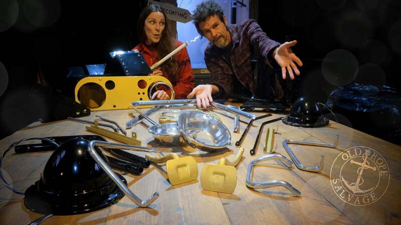 Man and woman in a workshop with some powder coated parts off a Bedford truck