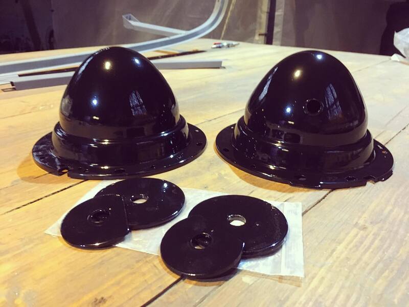 Black powder coated headlamp buckets from a Bedford Truck