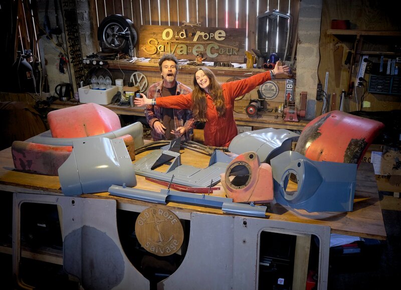 Man and woman in old rope salvage workshop with a workbench full of Bedford truck panels