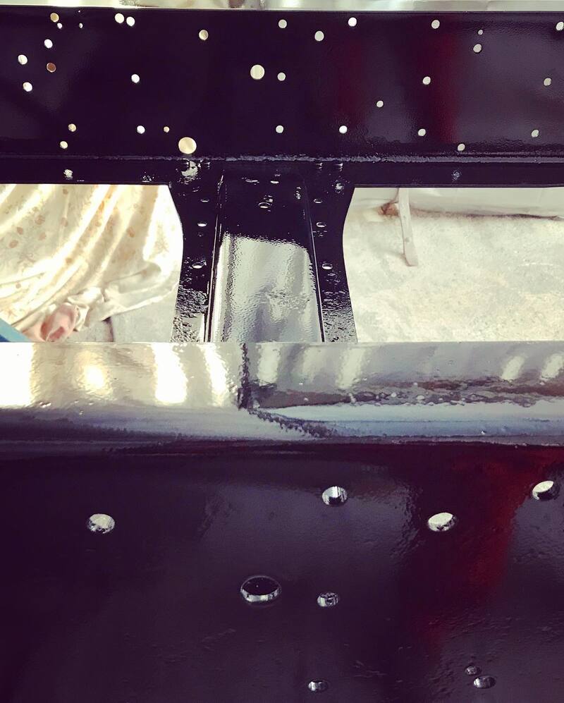 Close up of black truck chassis frame