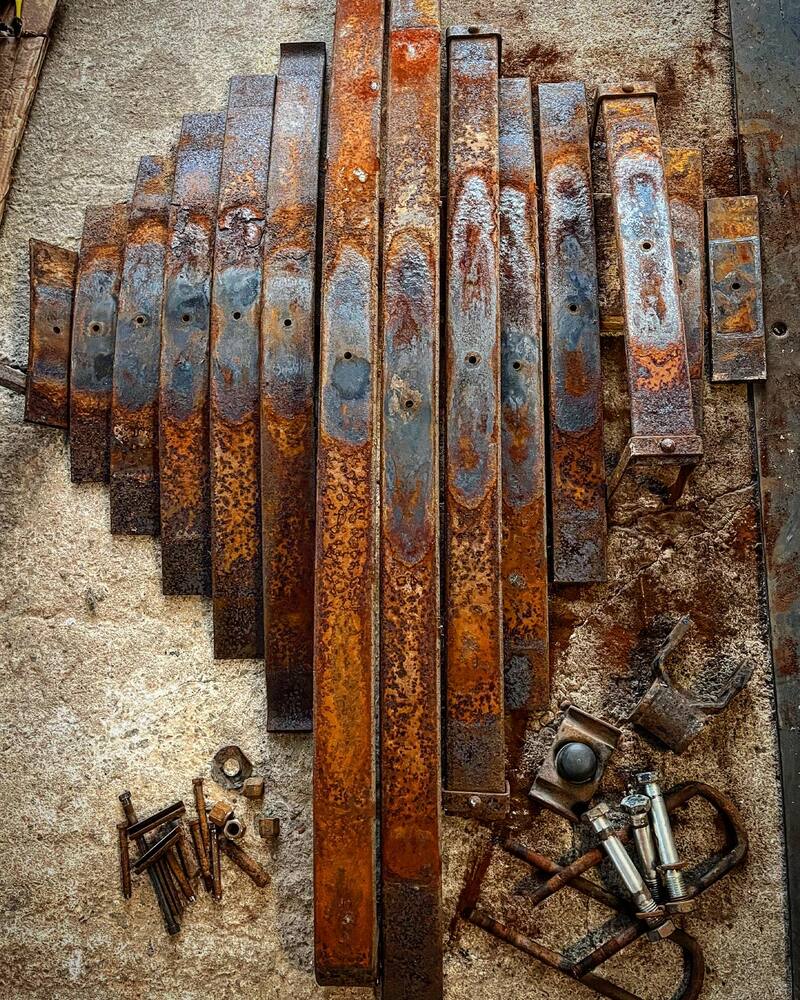 Rusty truck leaf springs in pieces
