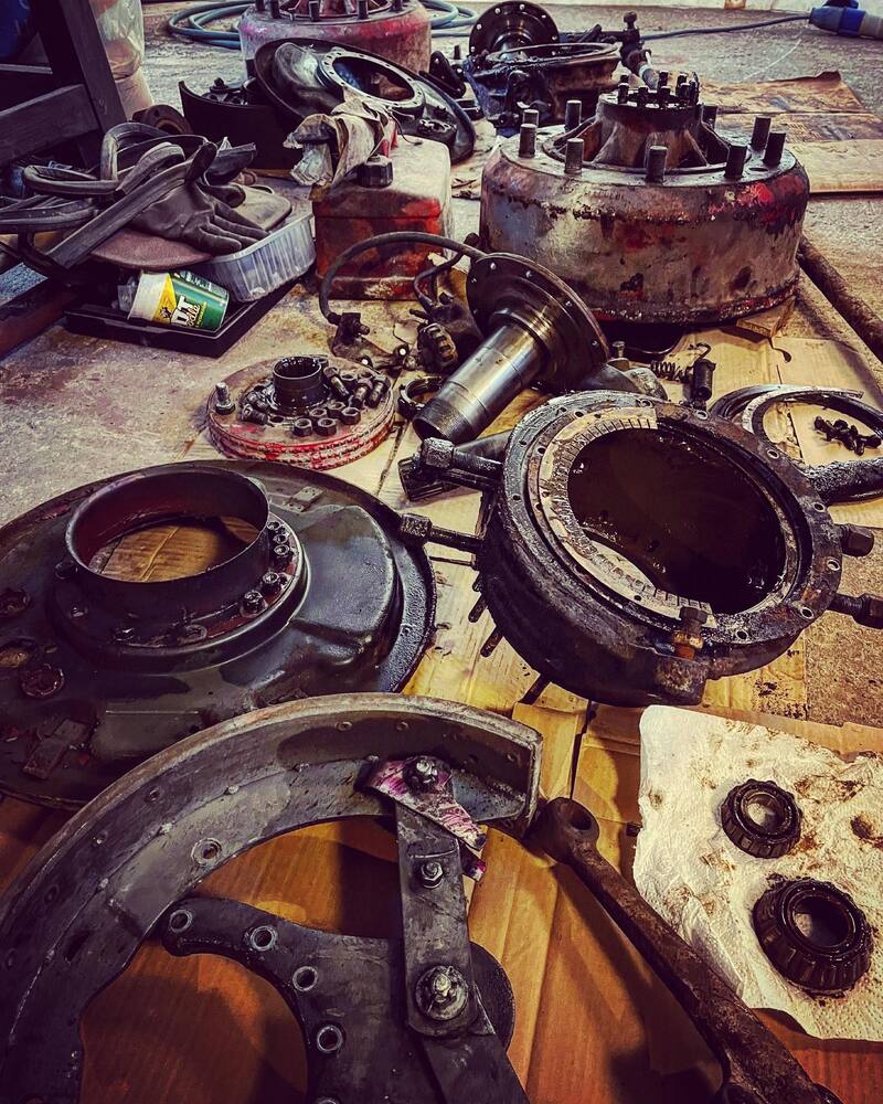 Disassembled pieces of the front axle of a Bedford truck