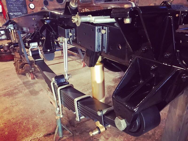 Newly restored Bedford truck chassis getting put back together