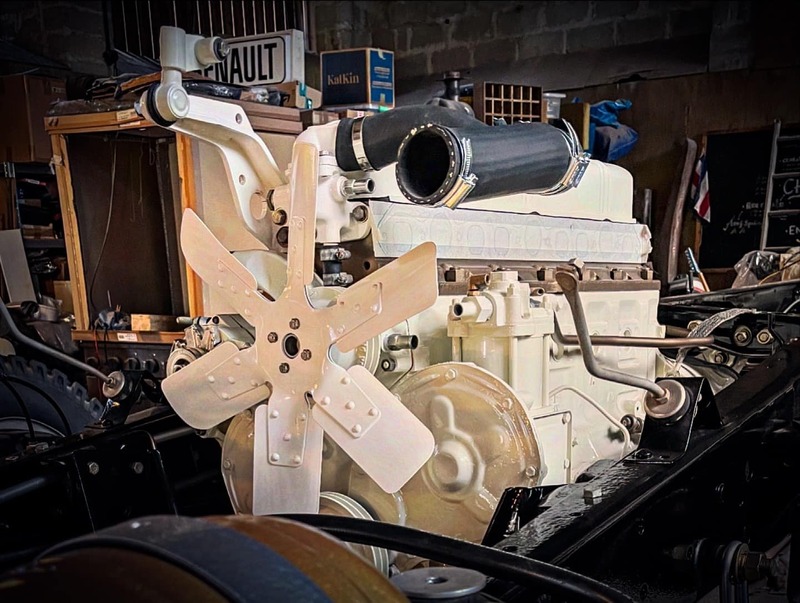 White painted Bedford truck engine in situ