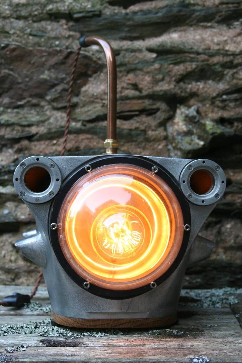 Large metal submersible camera upcycled into a desk lamp