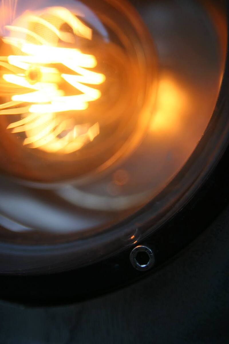 Large metal submersible camera upcycled into a desk lamp