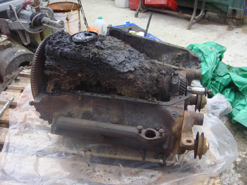 Rodent's nest inside the engine of an old Ford pick-up truck