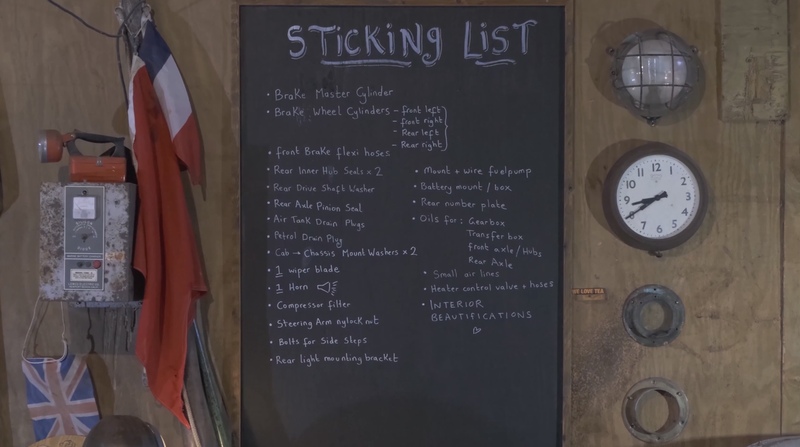 A chalkboard with a list of jobs and car parts titled ‘sticking list’